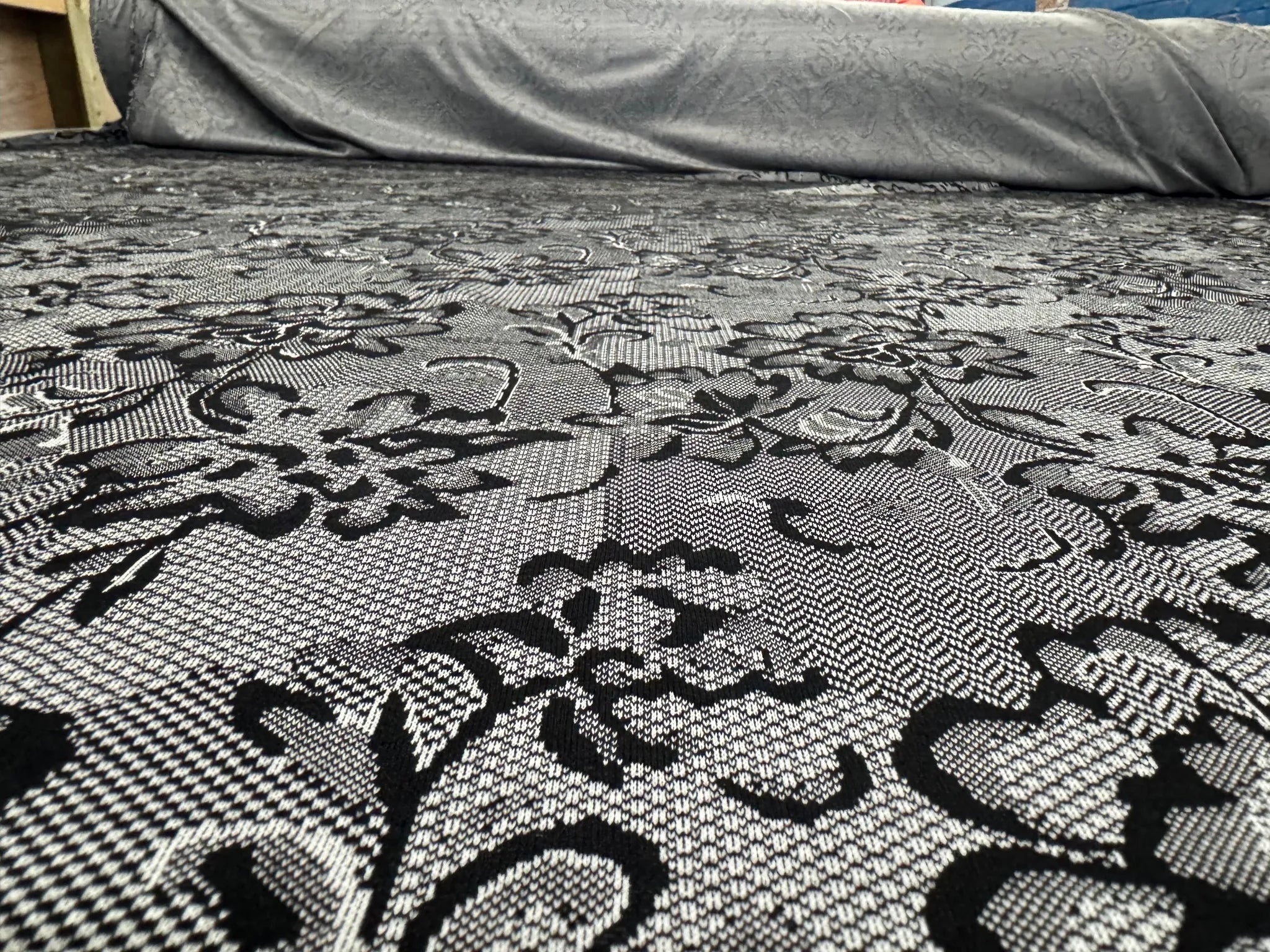 Soft jersey fabric with lace pattern draped elegantly