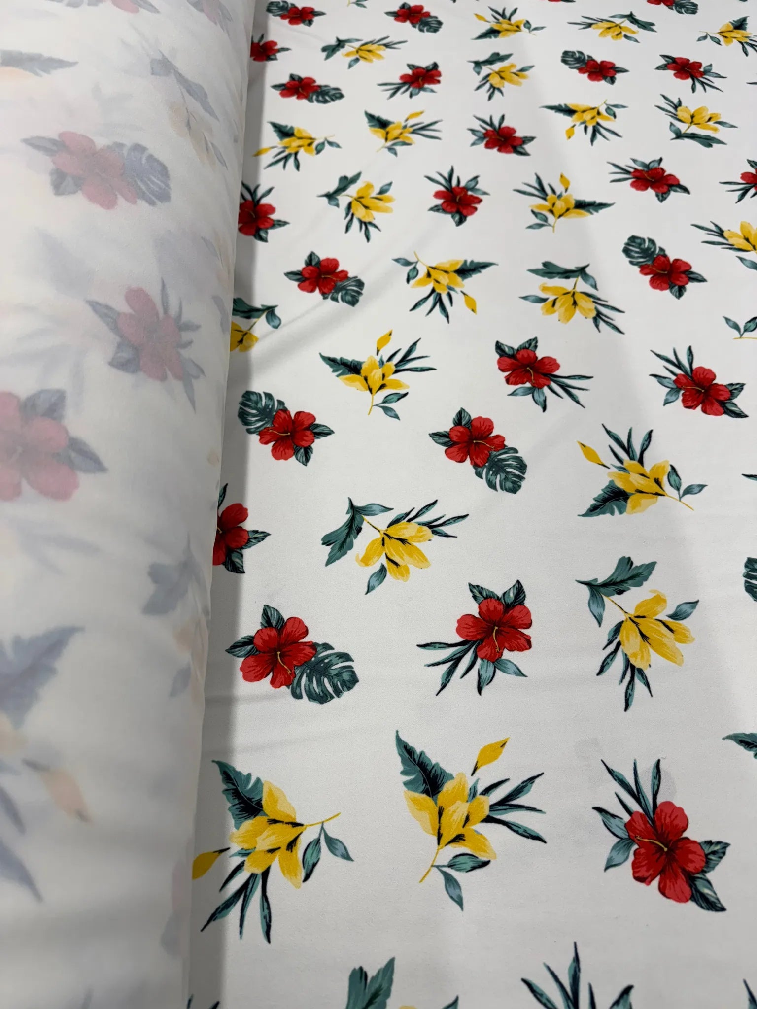 Close-up of red and yellow hibiscus print fabric