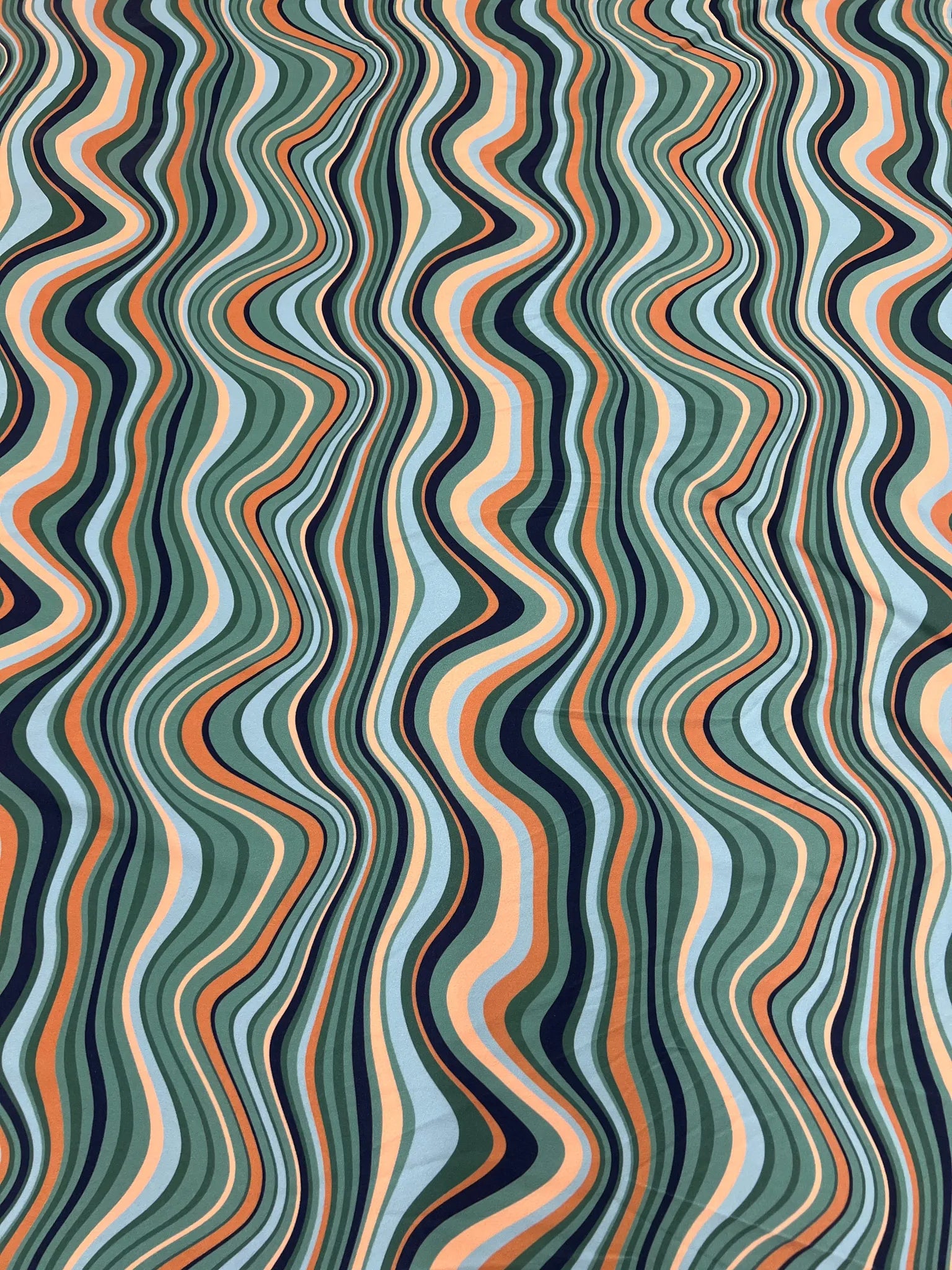 Draped Green Orange Black Swirl Jersey Crepe fabric