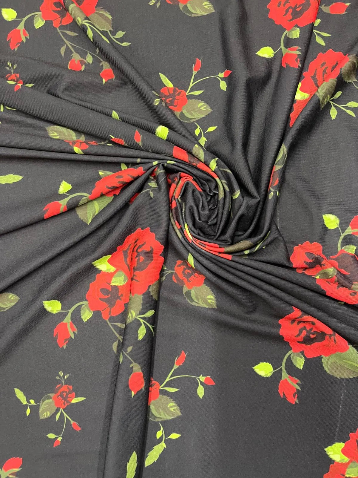 Black and red rose floral polyester jersey fabric swatch.