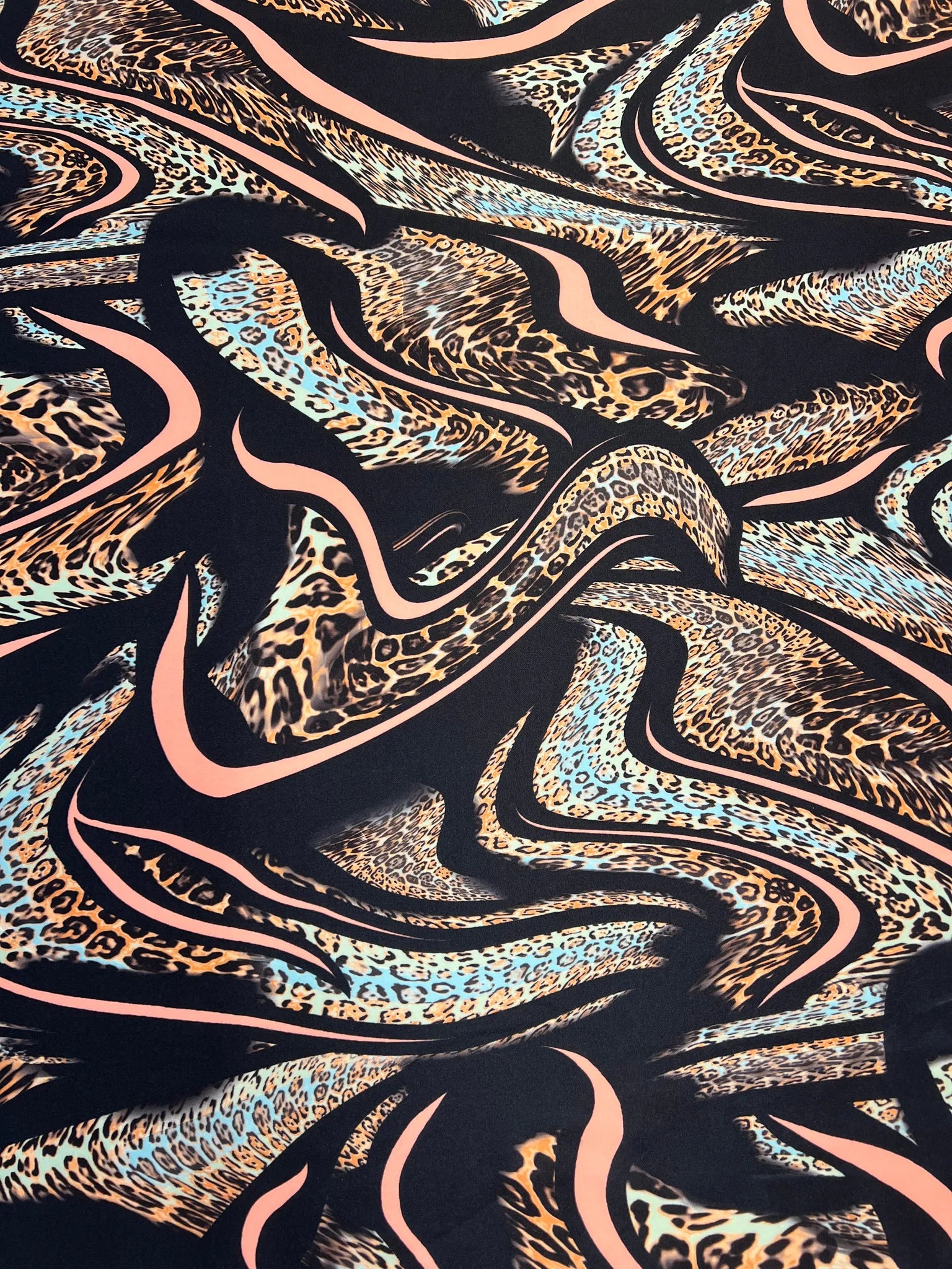 Close-up of soft scuba stretch fabric with multi-tone print