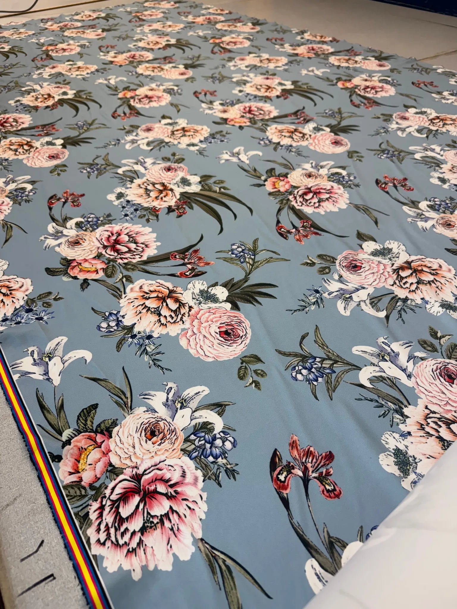 Close-up of dusty blue floral scuba fabric texture