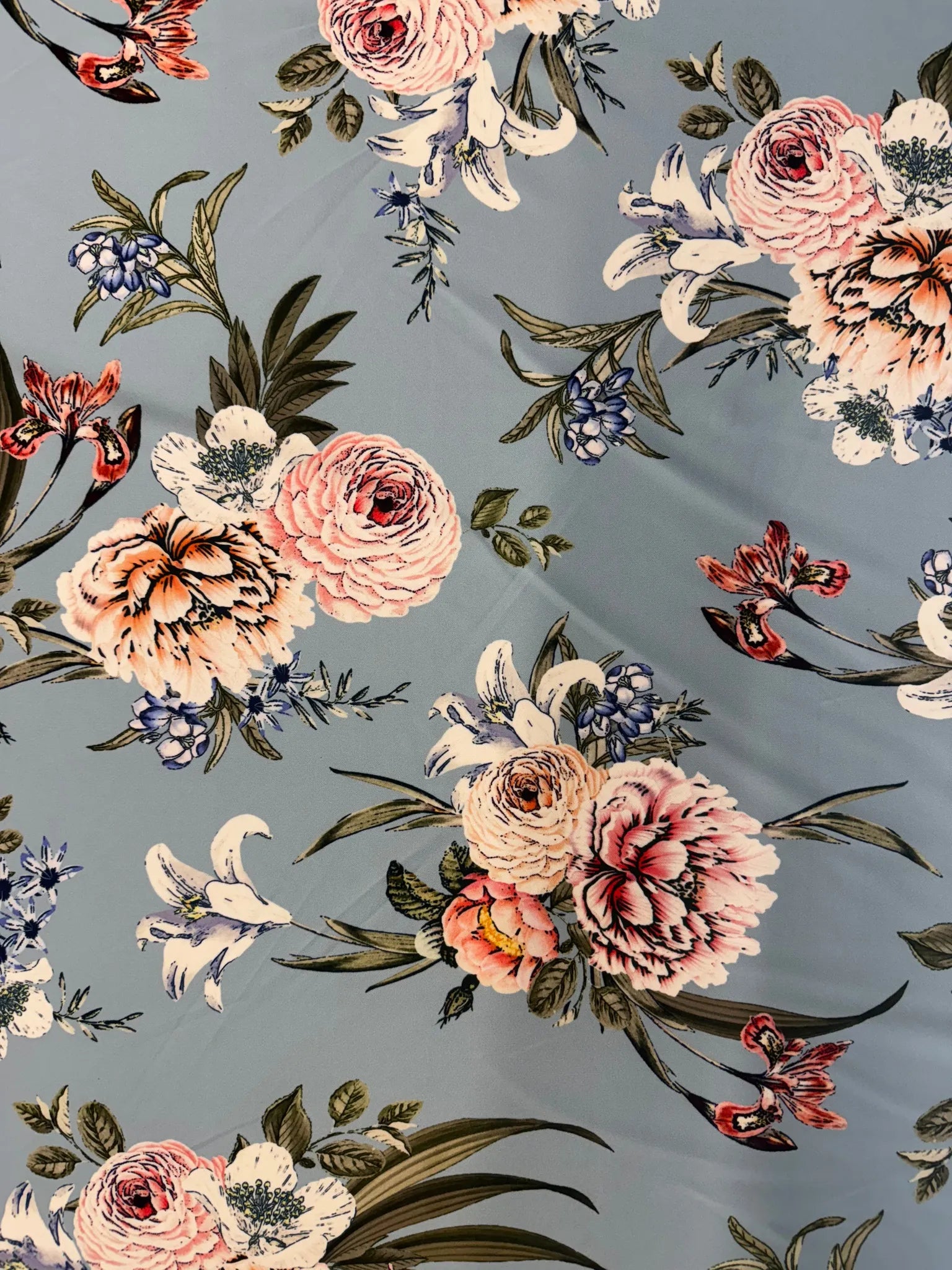 Dusty blue floral stretch scuba fabric draped