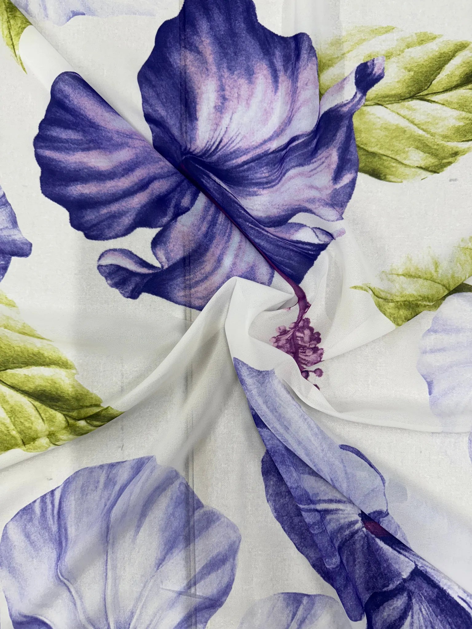 White tropical hibiscus floral fabric with purple blooms