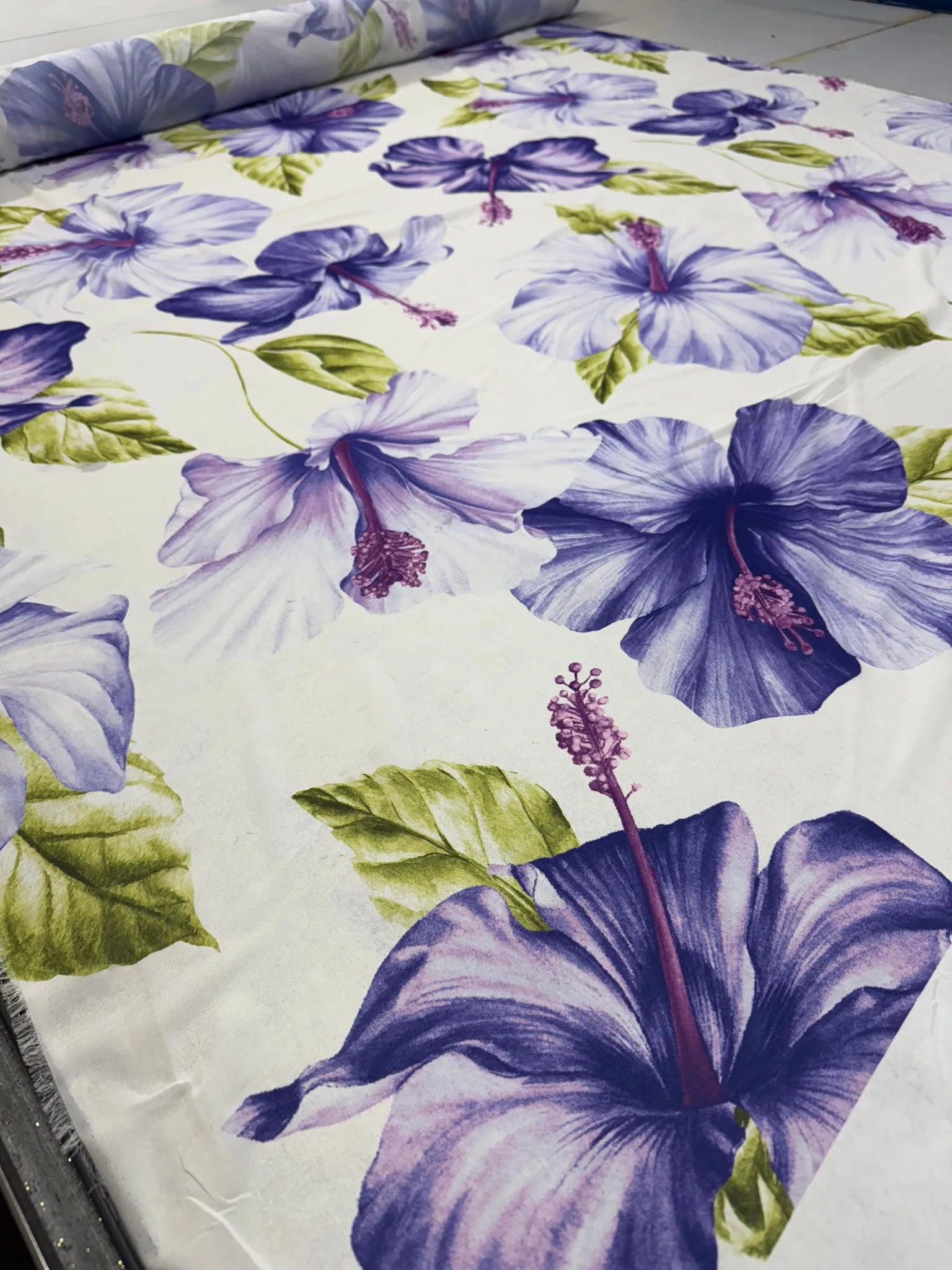 Lightweight woven fabric featuring tropical hibiscus flowers