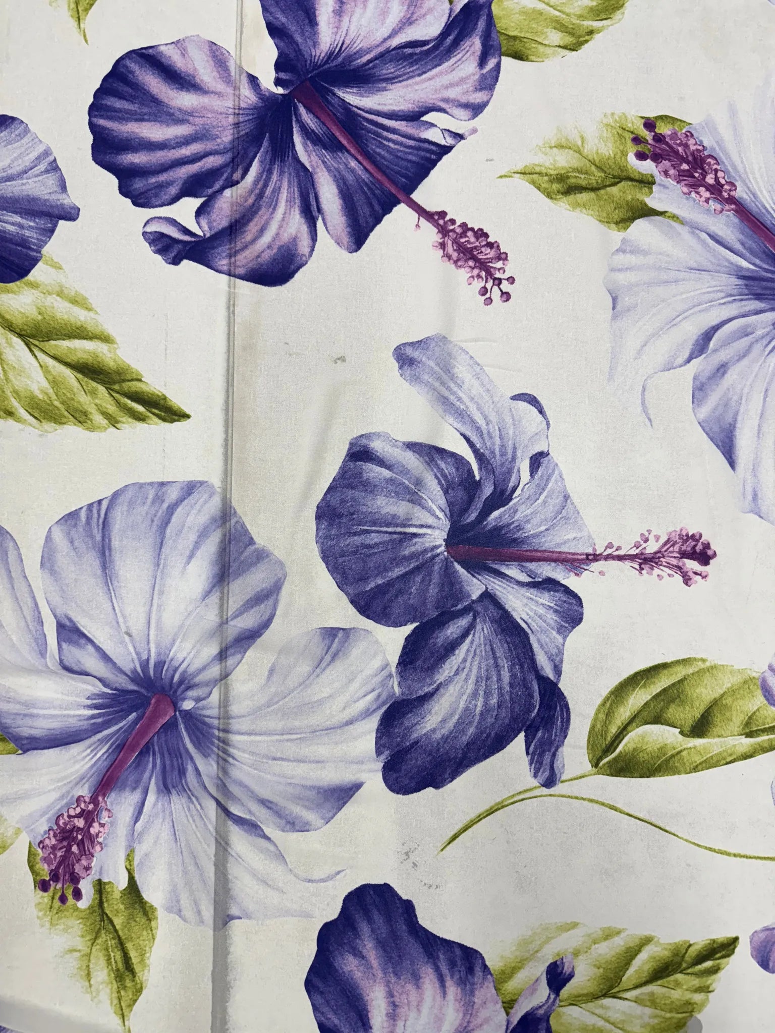 Soft drape of white hibiscus floral fabric for sewing