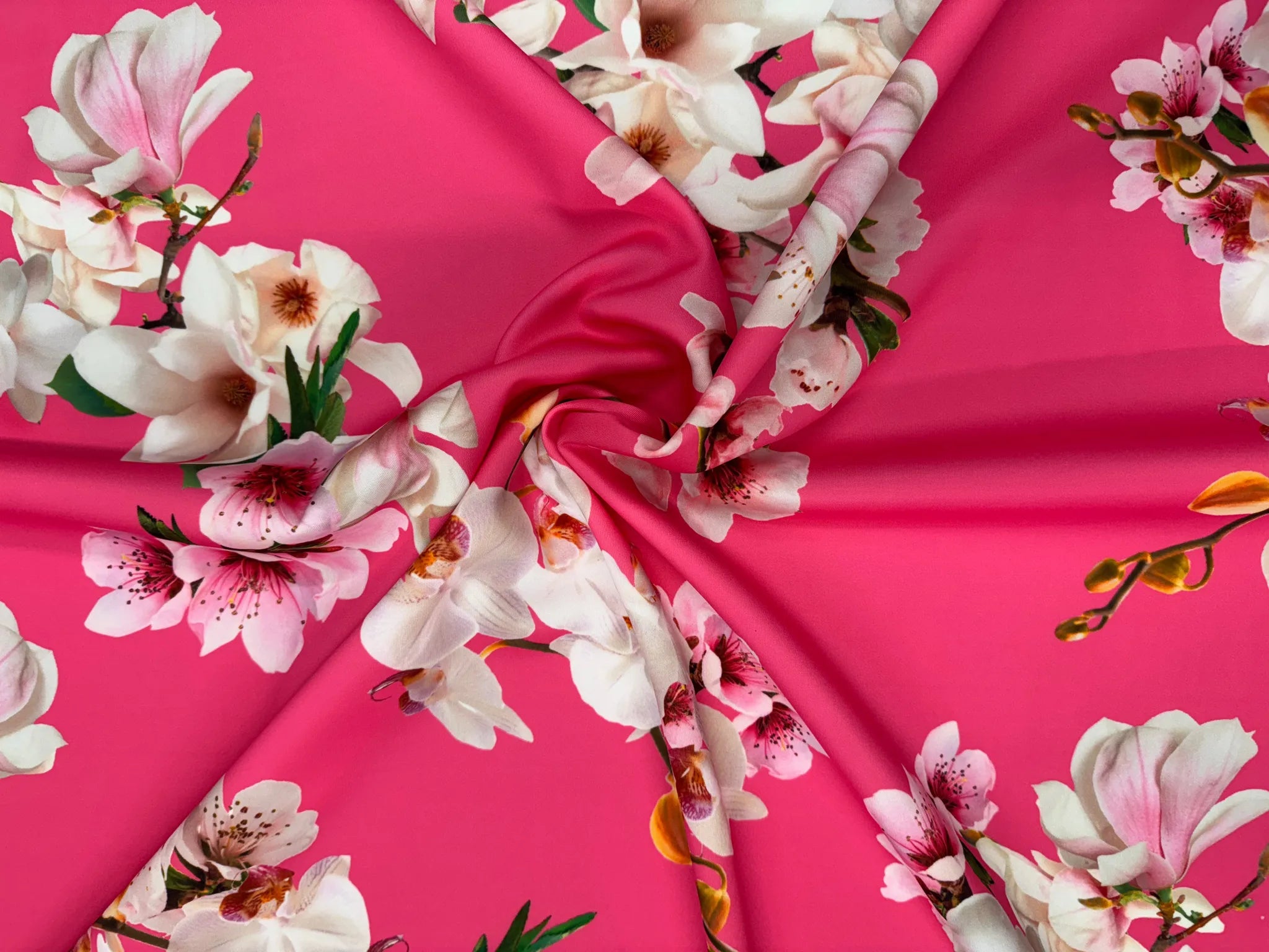 Hot pink orchid floral print fabric on a white background