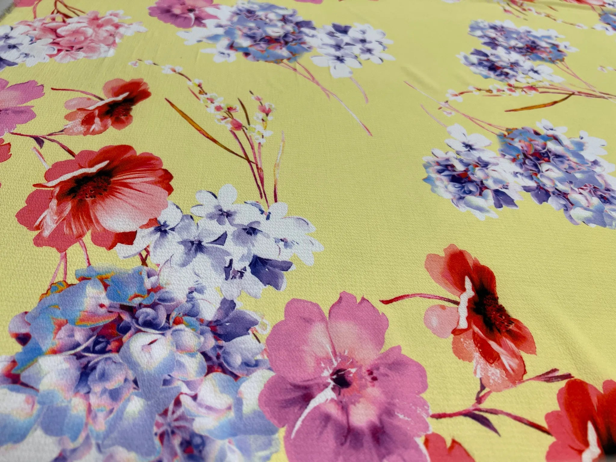 Soft textured bubble crepe fabric in vibrant yellow