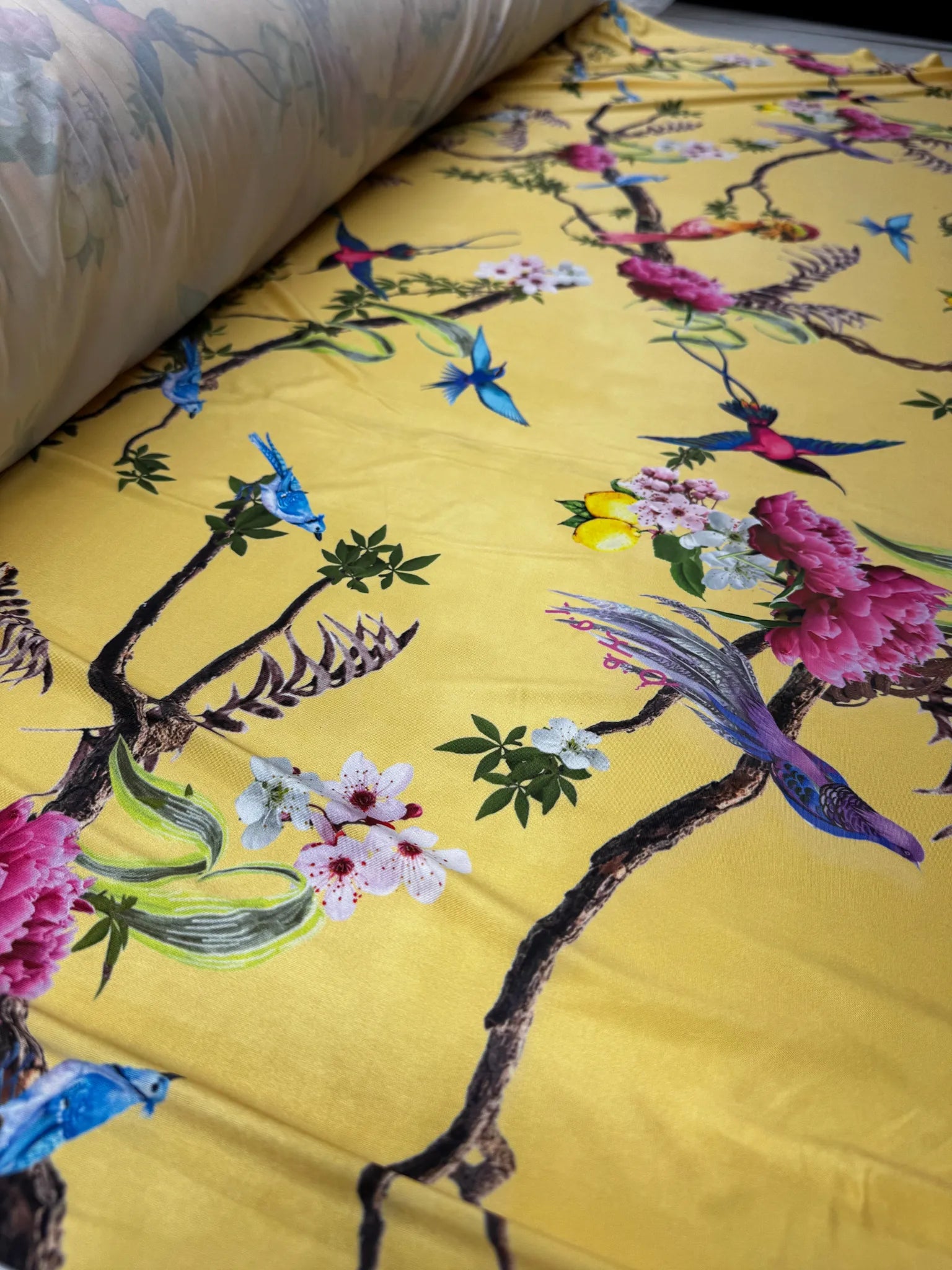 Close-up of soft touch yellow fabric with floral design