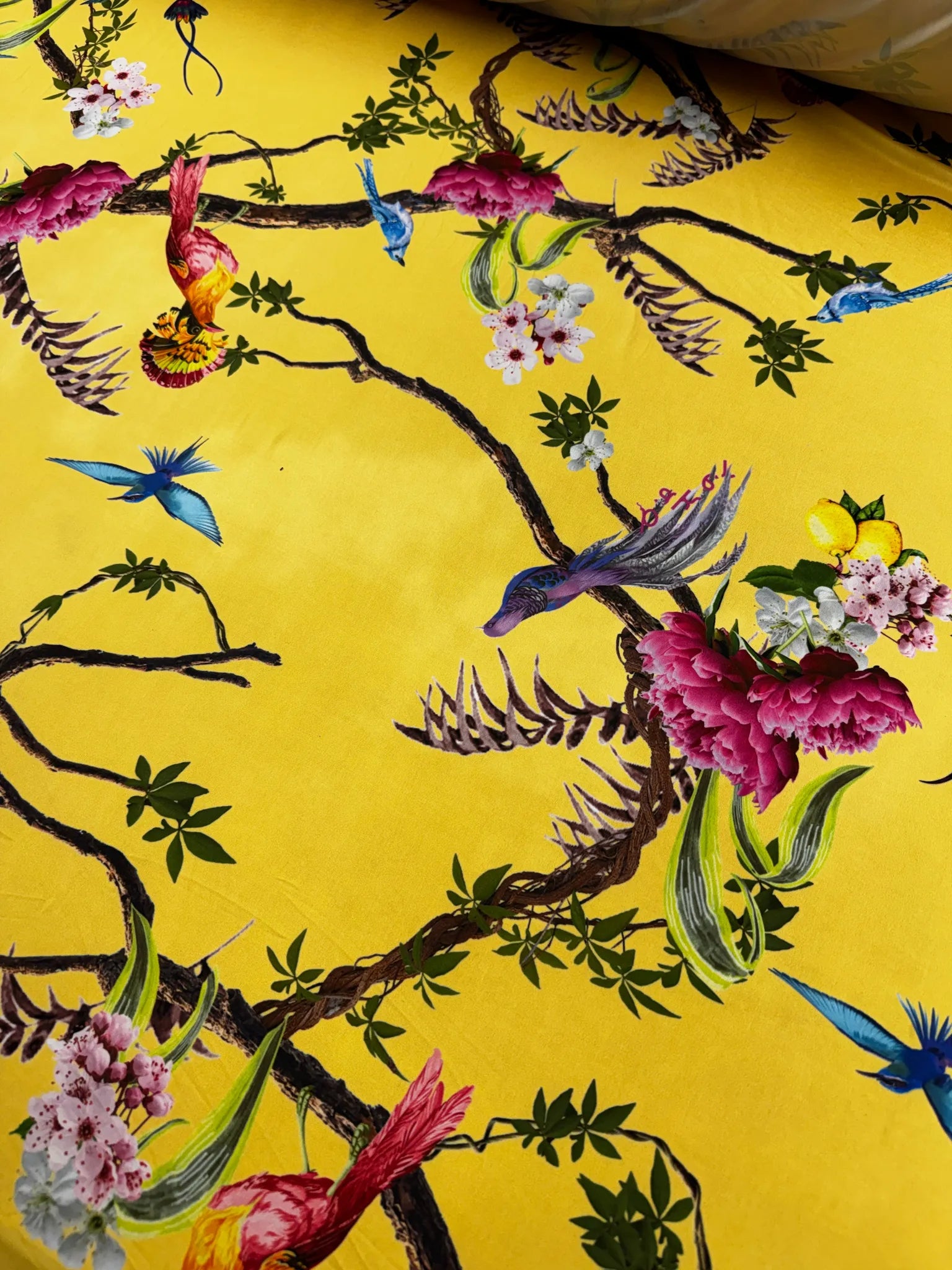 Fluid drape of vibrant yellow slinky jersey fabric