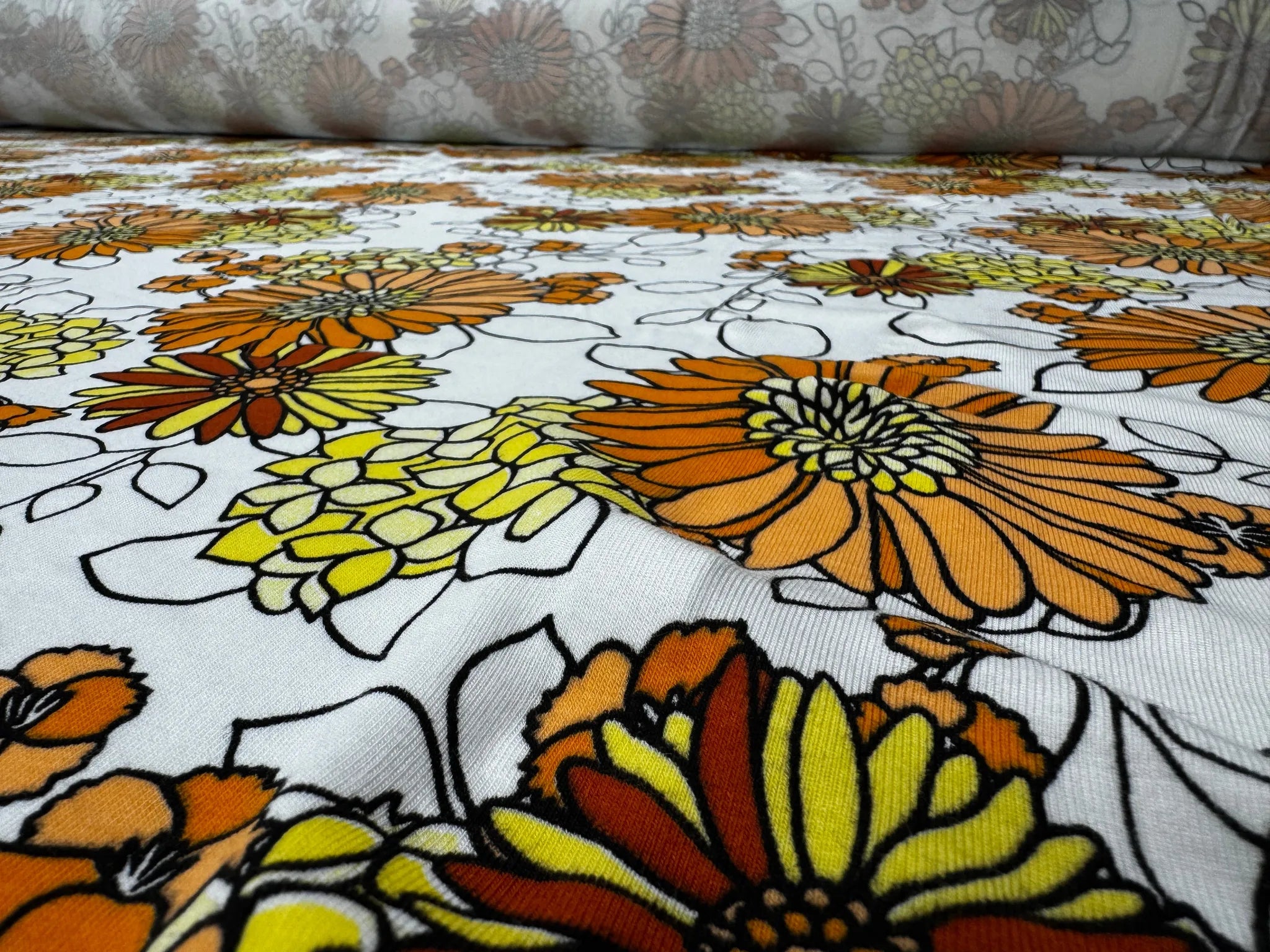 Lightweight orange floral fabric ideal for summer outfits