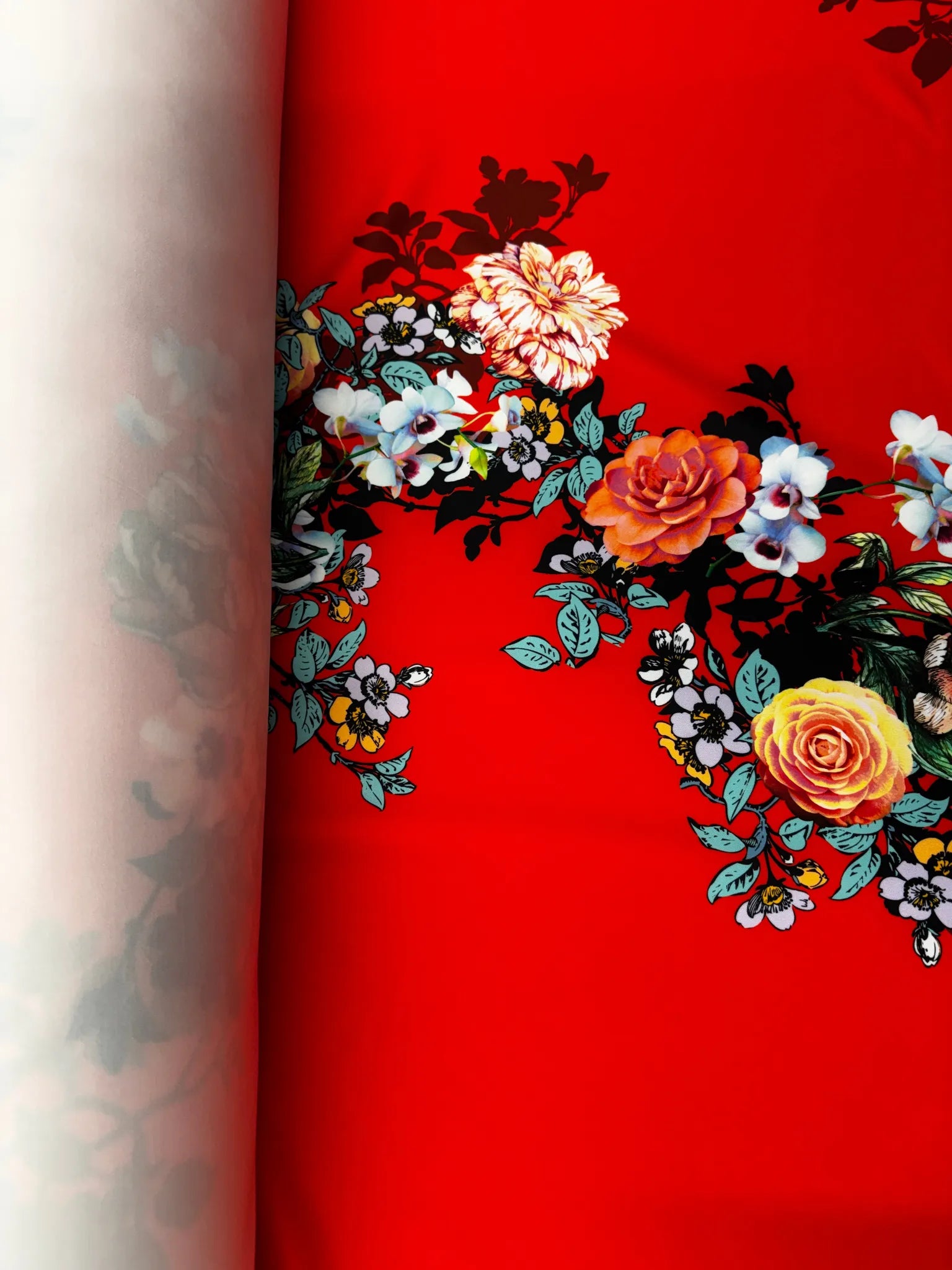 Smooth and structured red floral scuba fabric for sewing