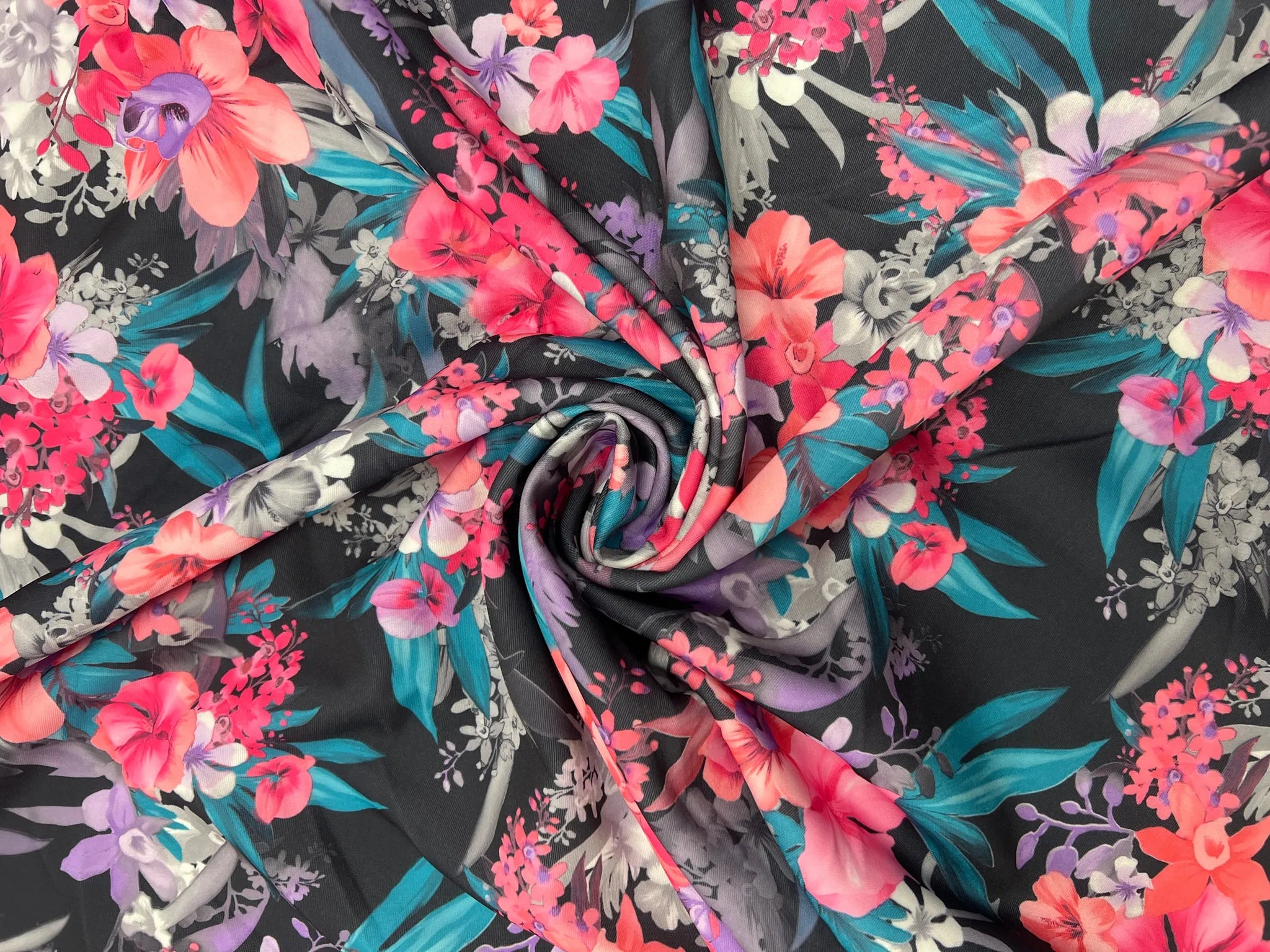 Midnight Tropic Bloom Scuba Knit fabric on a table