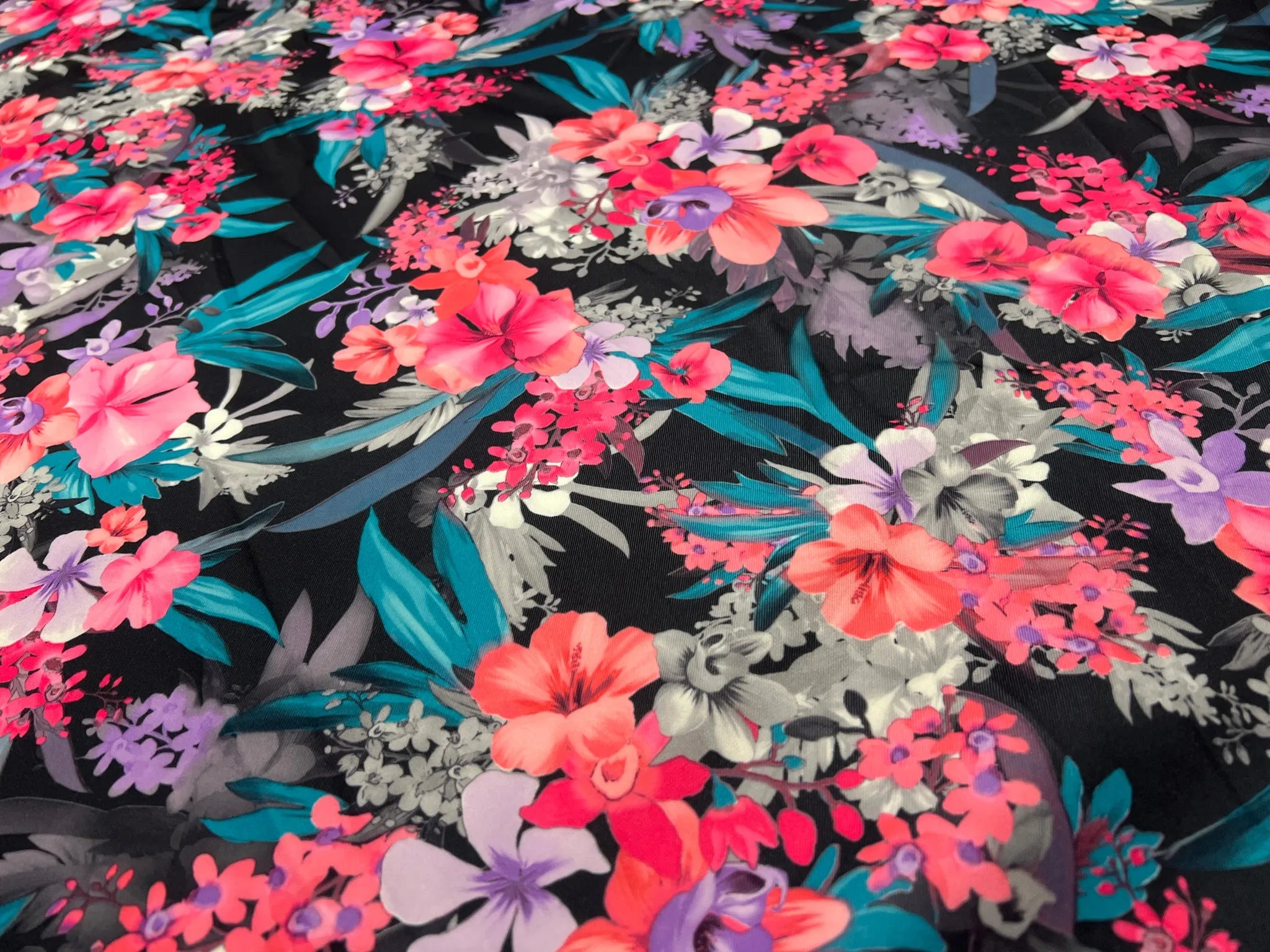 Flat lay of Midnight Tropic Bloom Scuba Knit fabric