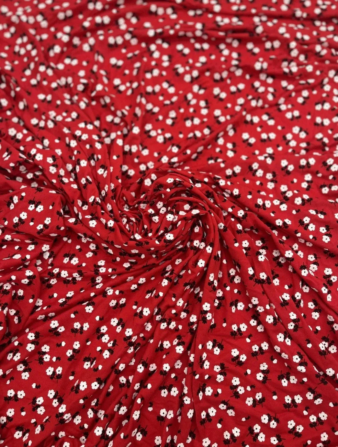 Red and white ditsy floral viscose fabric for dressmaking
