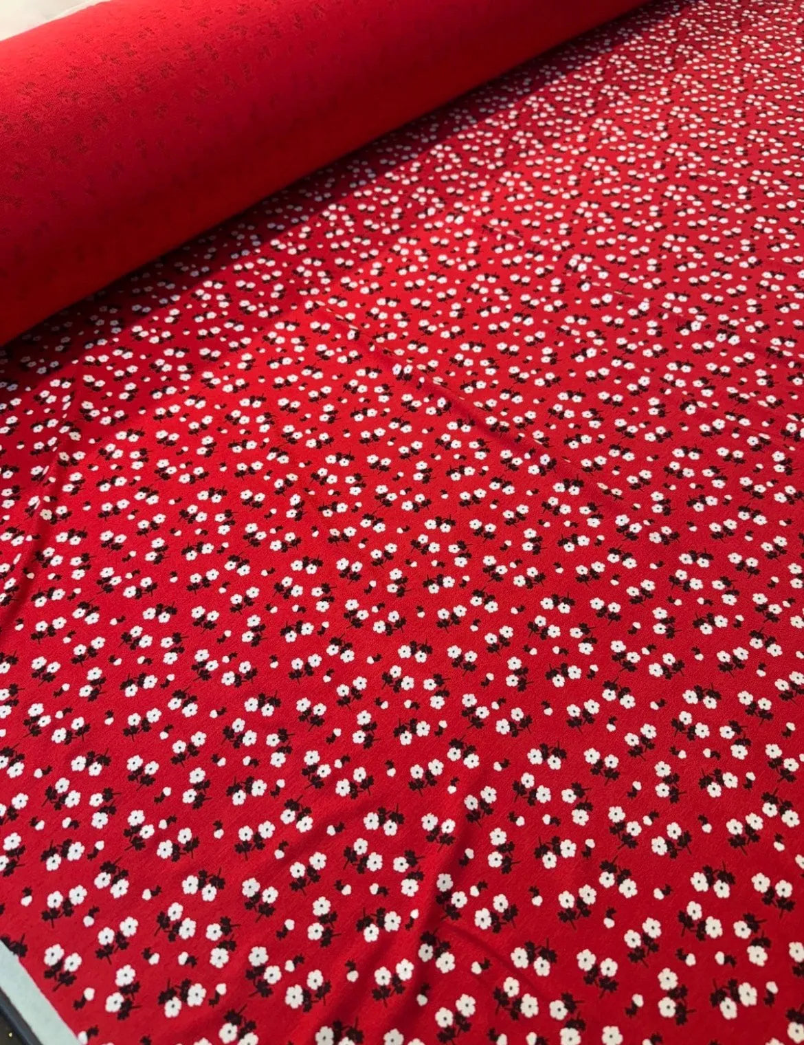 Soft viscose fabric draping beautifully in red and white