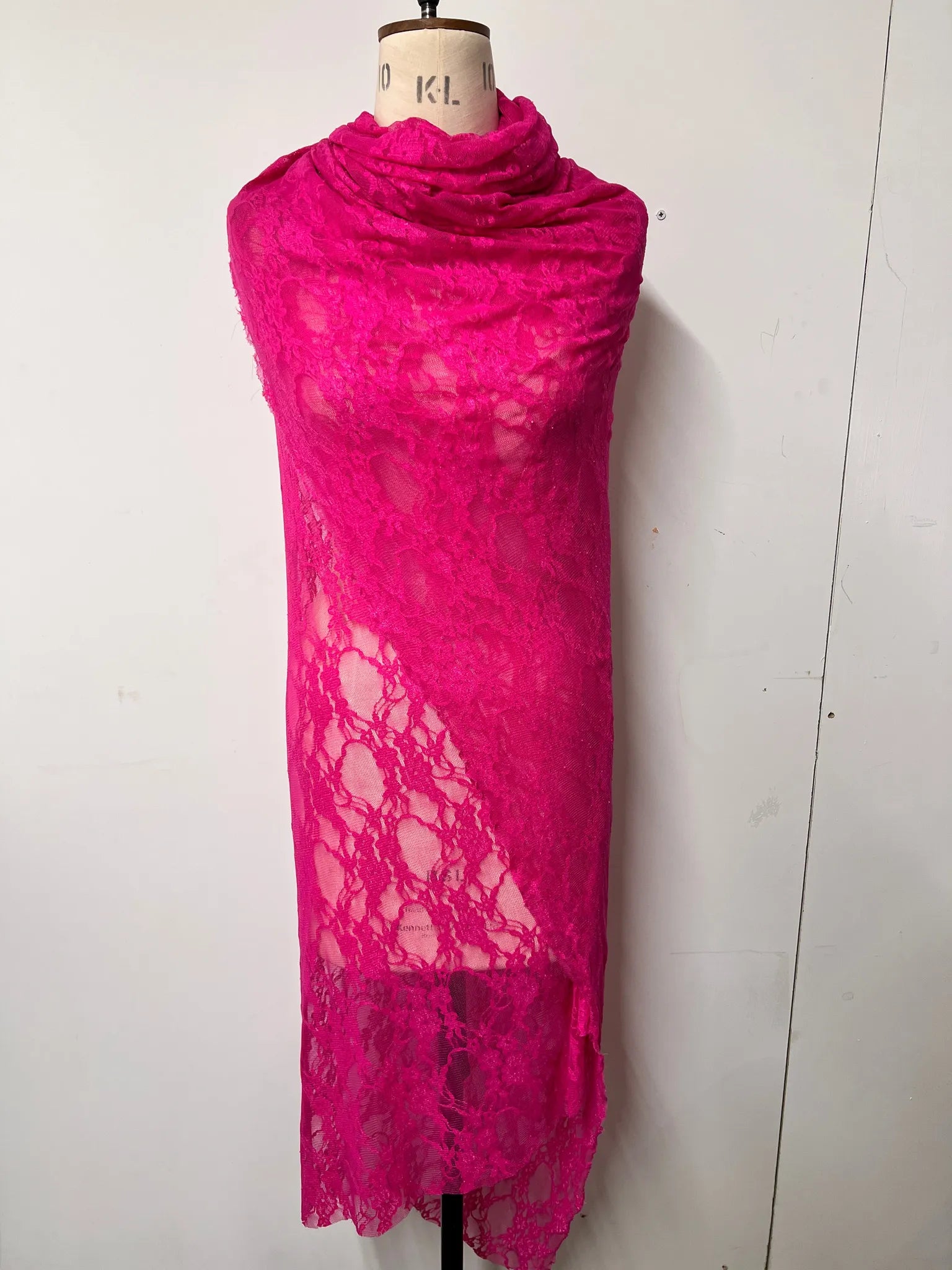 Hot pink lace fabric ideal for costumes and decorative projects