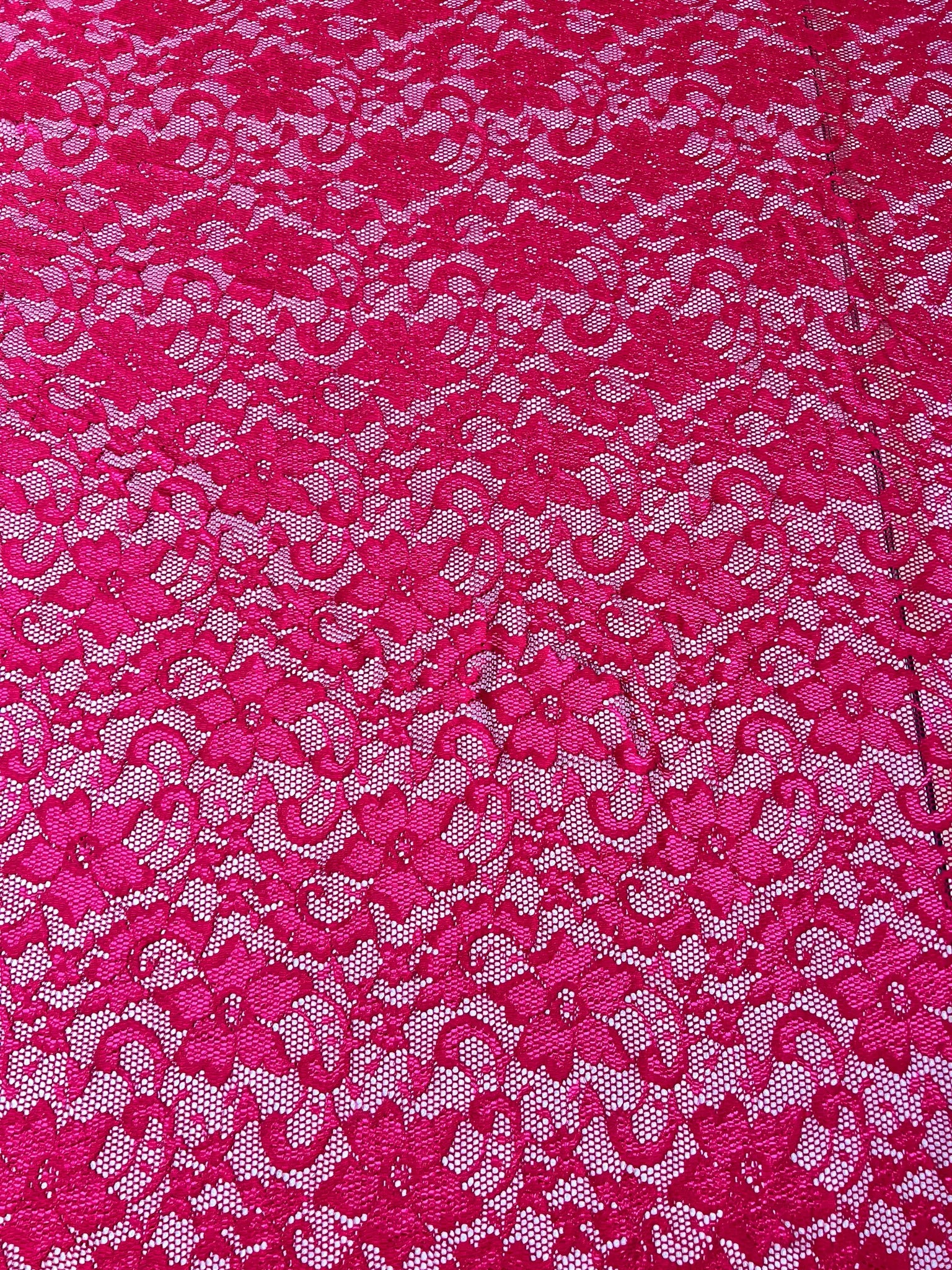 Lightweight Burgundy Lace Fabric draped elegantly.