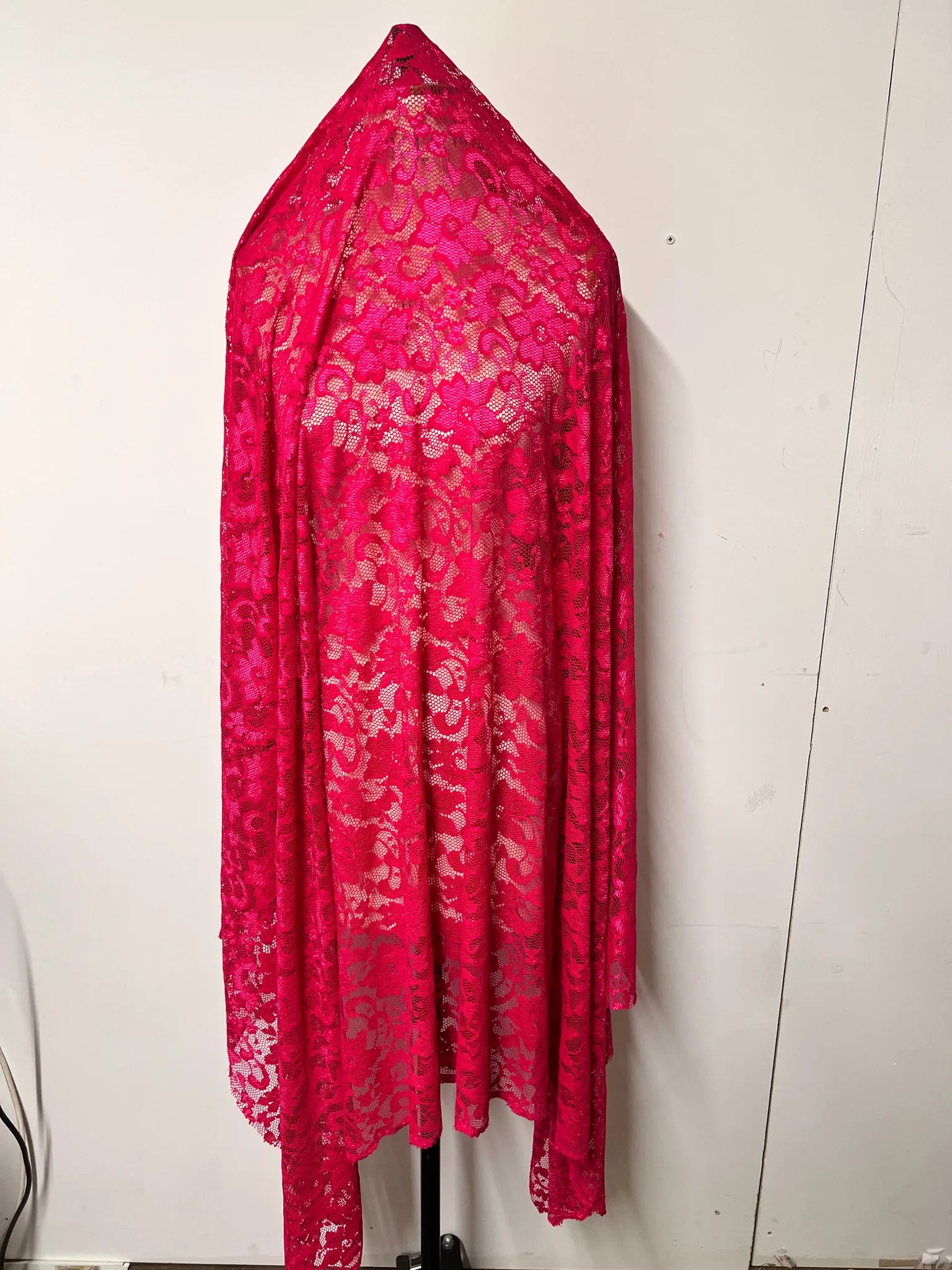 Layers of Premium Burgundy Lace Fabric showcased.