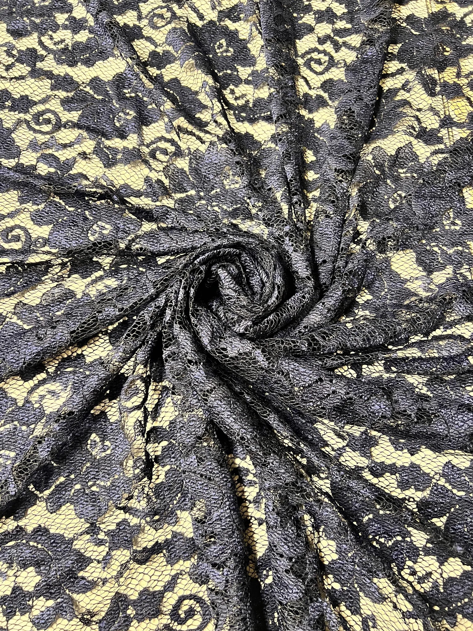 Premium navy lace fabric with floral design detail