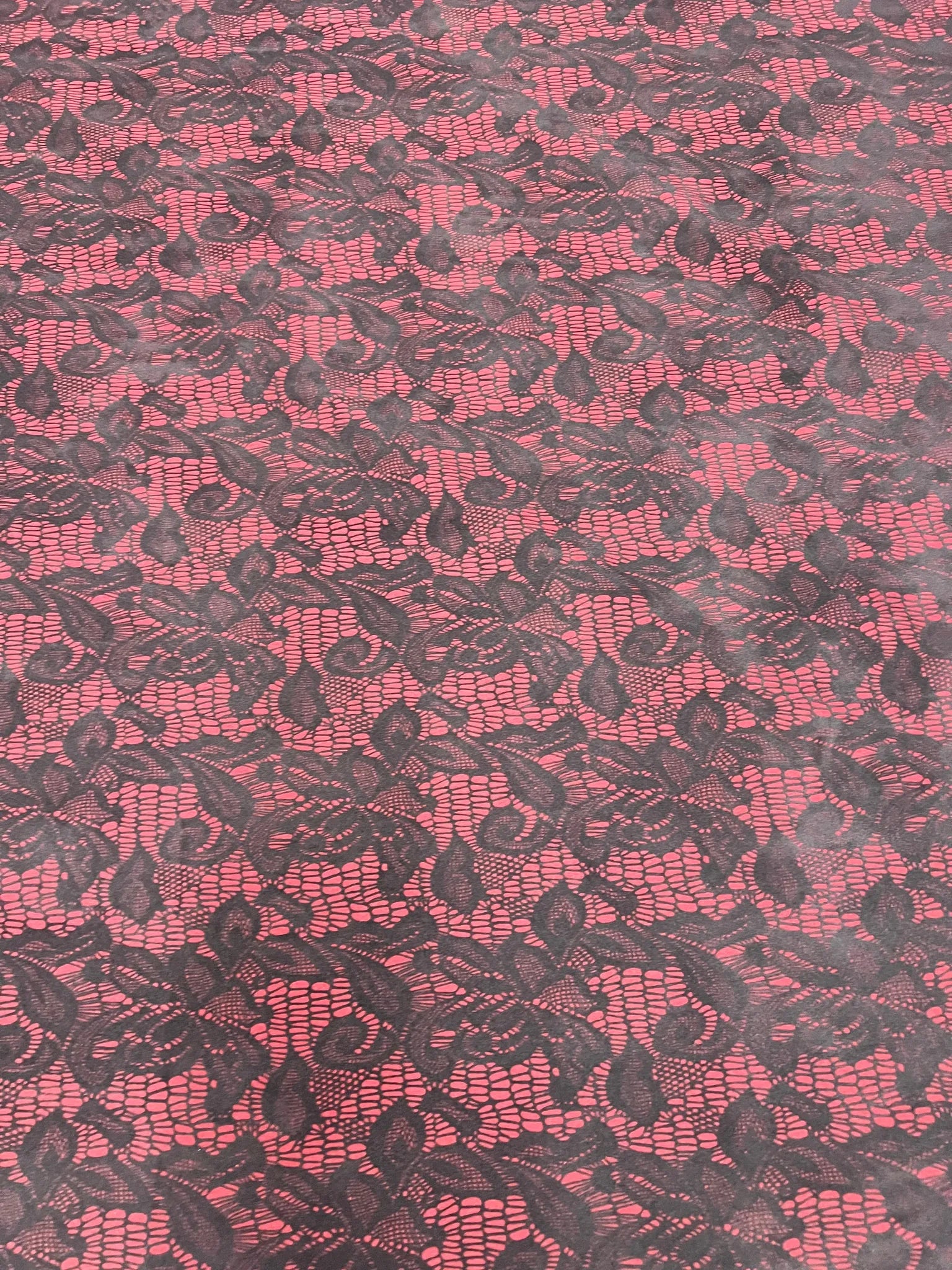 Soft stretch jersey knit fabric in red and black lace print