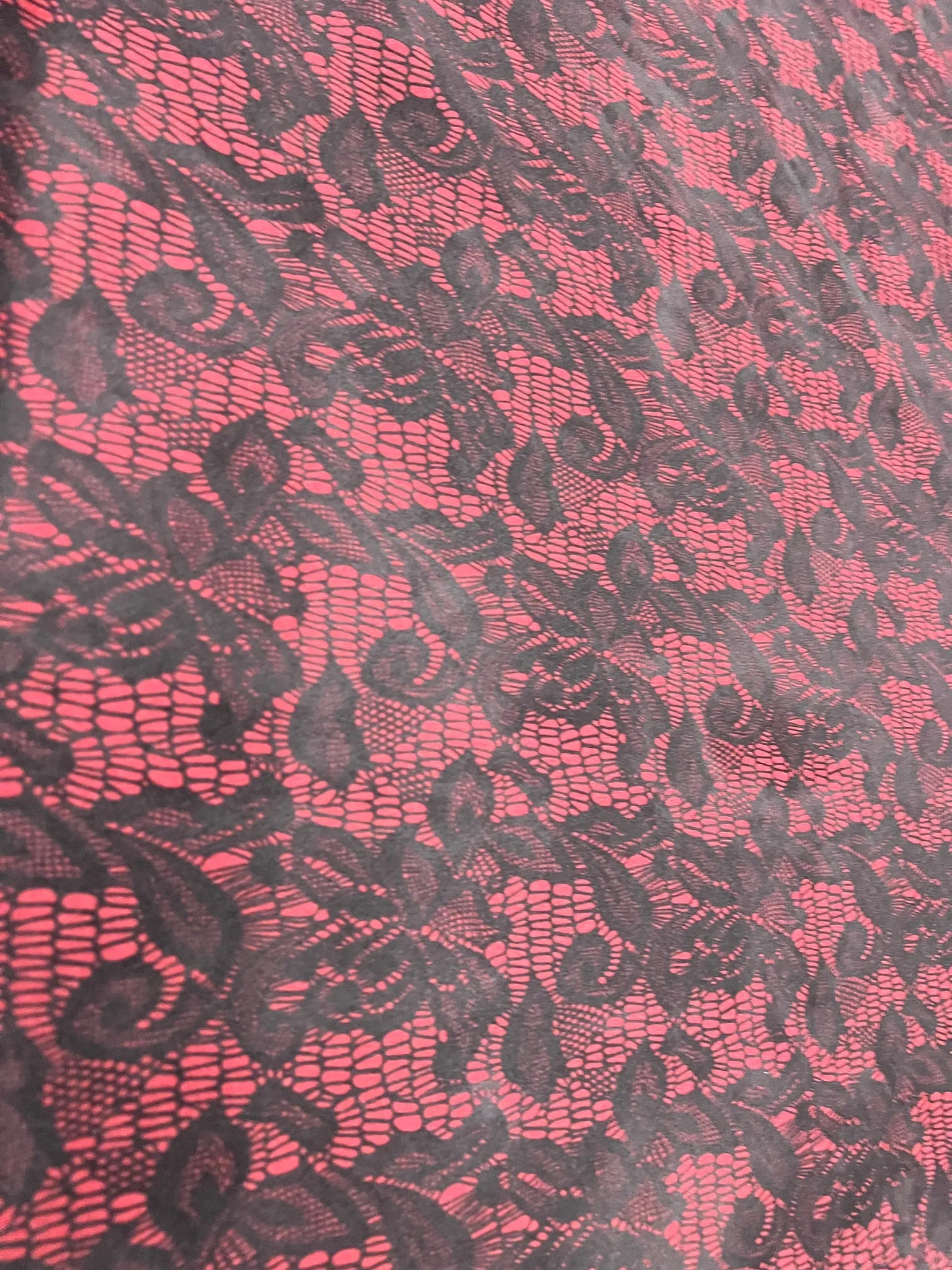Beautiful drape of red black lace print jersey knit fabric
