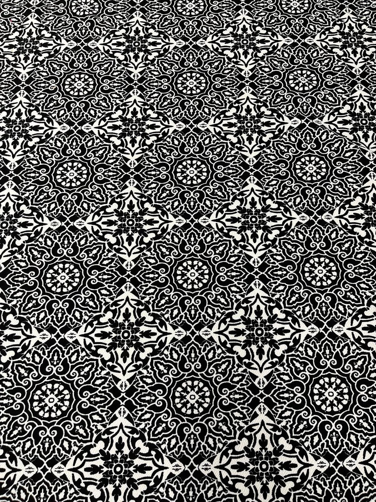 Structured black and white stretch fabric ideal for dresses.