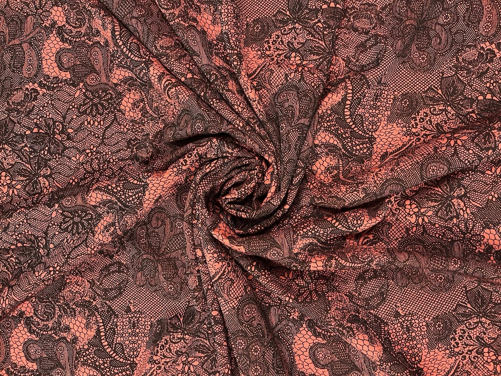 Coral Pink Stretch Lace Fabric with Black Floral Pattern – Elegant & Versatile